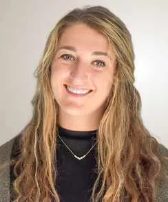 Postpartum doula assisting new mothers and families